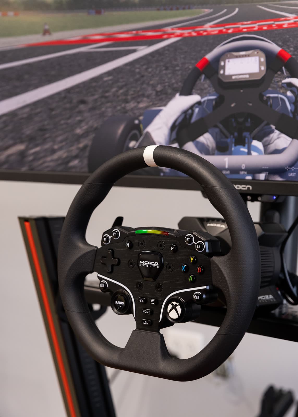A MOZA direct-drive wheel and paddle shifters on an MCK sim rig