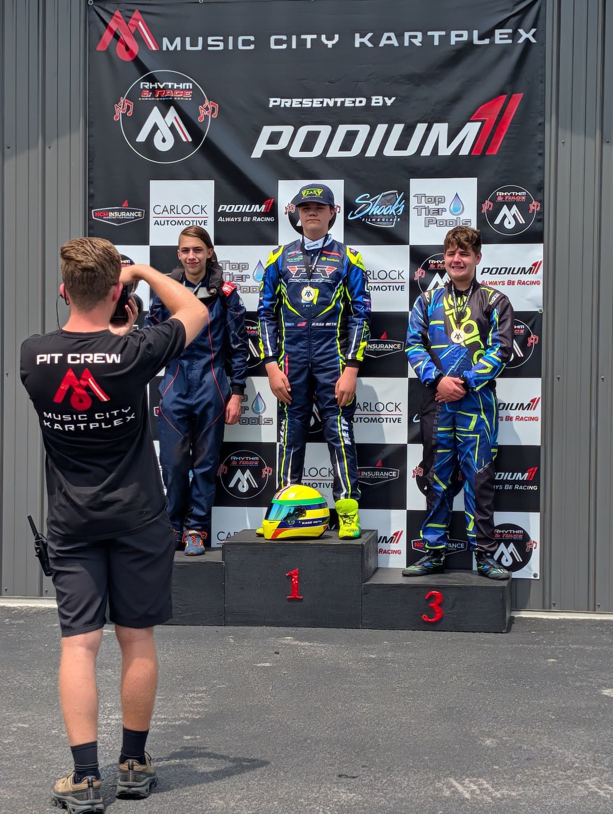 Racers on the podium after a final at Music City Kartplex