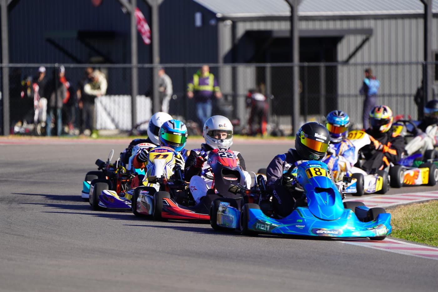 Karts racing wheel to wheel on the Music City Kartplex circuit